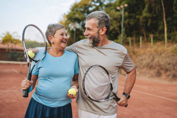 istock Senior couple playing tennis 2154343155