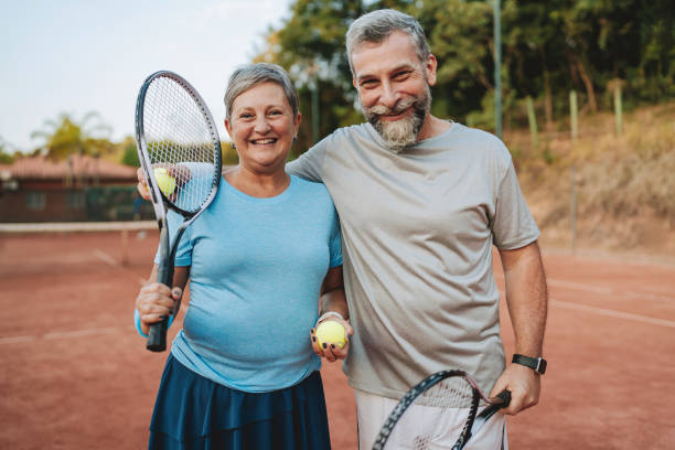 istock Senior couple playing tennis 2154343173