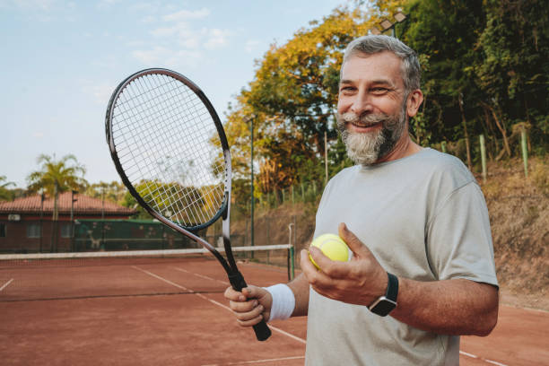 istock Portrait senior man playing tennis 2154343202