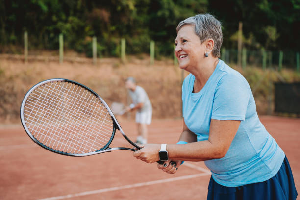 istock Elderly woman playing tennis 2154343204
