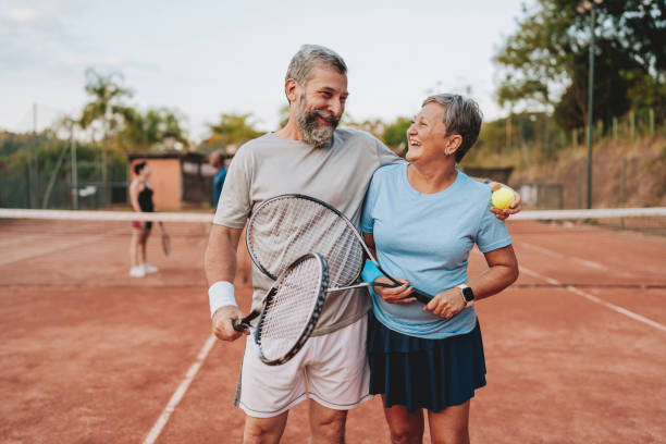 istock Senior couple playing tennis 2154343213