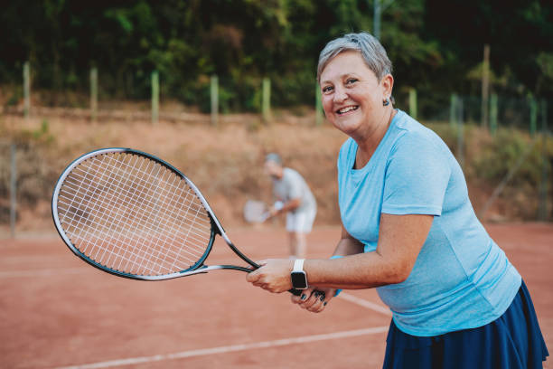istock Elderly woman playing tennis 2154343234