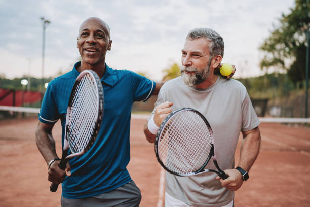 istock Two friends tennis game 2154343253