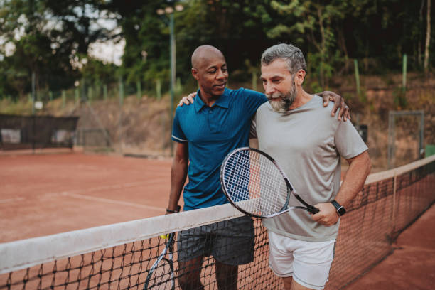 istock Two friends tennis game final 2154343398
