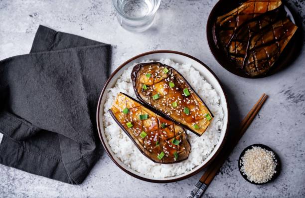 istock Teriyaki sauce eggplant slices with rice in a bowl 2154347219