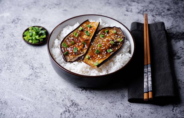 istock Teriyaki sauce eggplant slices with rice in a bowl 2154347220