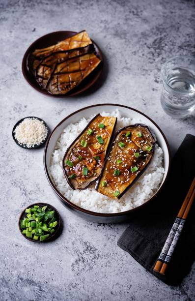 istock Teriyaki sauce eggplant slices with rice in a bowl 2154347227