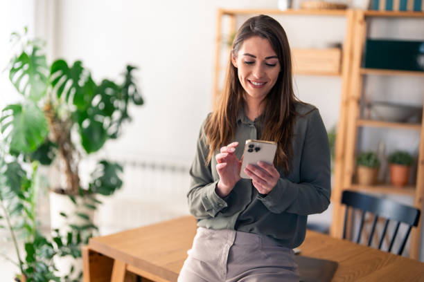 istock Successful confident woman entrepreneur with mobile phone indoors 2154355794