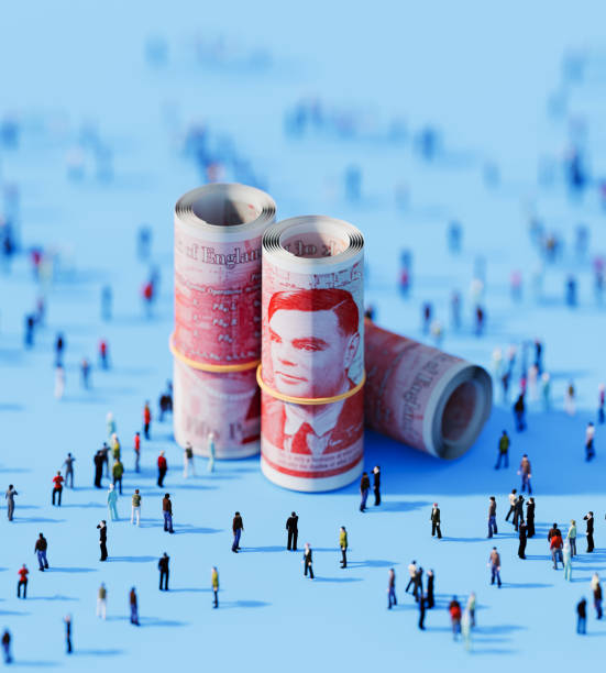 istock Crowd Of People Gathering Around Rolled Up 50 British Pound Bills On Blue 2154356227