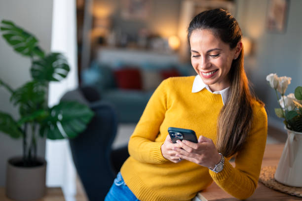 istock Happy female scroll on cellphone, news app and search digital information 2154358968