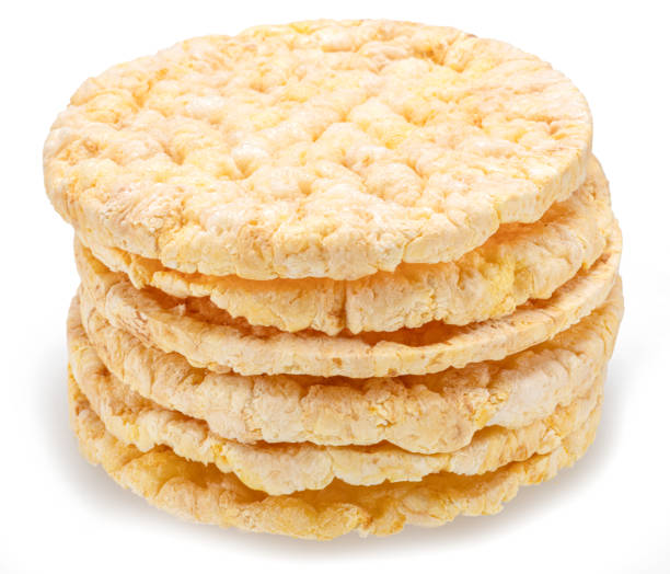 istock Puffed corn cakes or rice cakes isolated on white. Alternative snack for bread product 2154359012