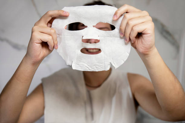 istock Beauty face mask in young man hands 2154359668