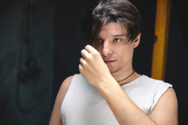 istock Man checking quality of his hair 2154359672