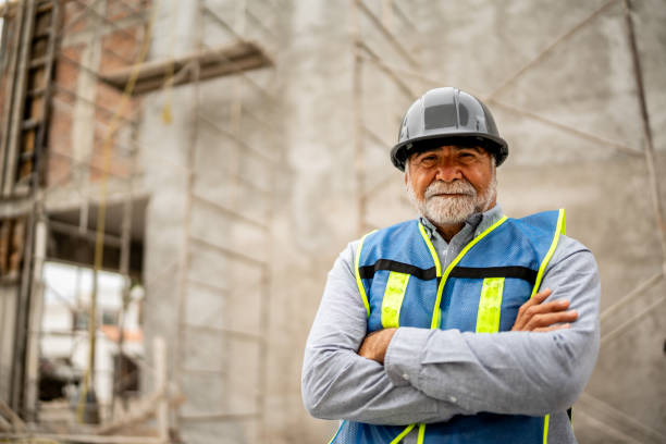 istock Portrait of senior builder man on construction site 2154361134