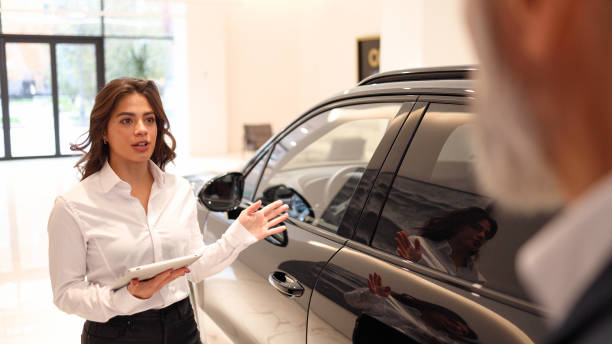 istock Young woman selling the car 2154362237