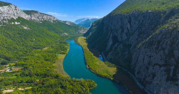 istock AERIAL: River gorge of Cetina cutting through the lush valleys and rugged cliffs 2154363457