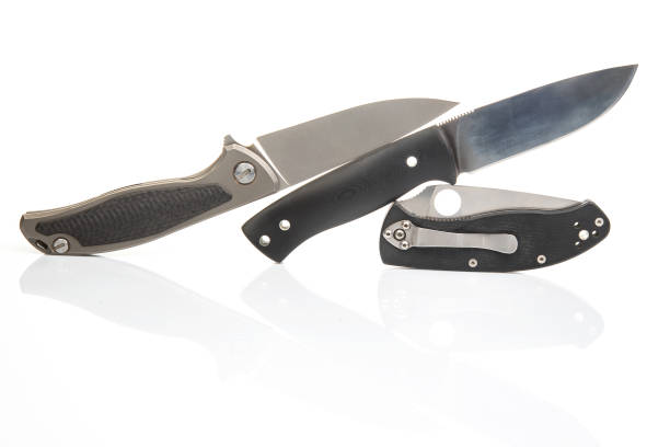 istock three different folding knives on a white background. item for tourism and survival 2154366097