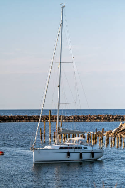 istock Sailboat moored to a pier in a small marina 2154371378