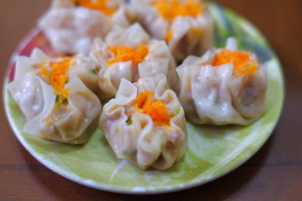 istock Steamed chicken dumpling dimsum served in plate 2154371956