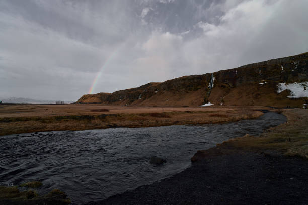 The Seljalandsfoss Waterfall is one of Iceland's most famous waterfalls that offers a stunning view and, in warmer months, a rare opportunity to walk behind the cascading water.