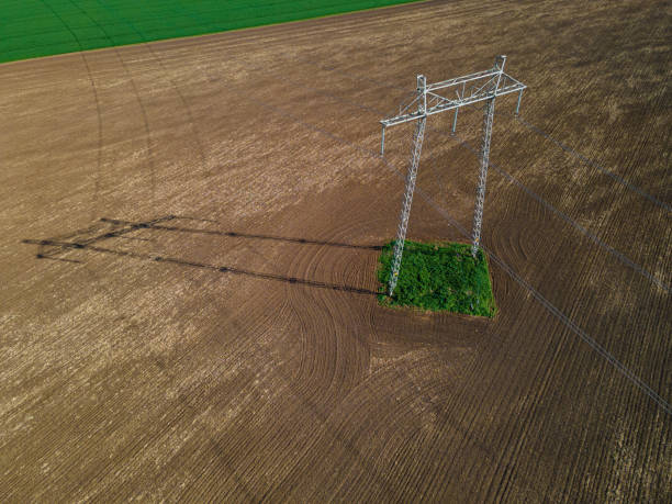 istock Electricity Pole in Cultivated Land in Spring, Aerial view. 2154372954