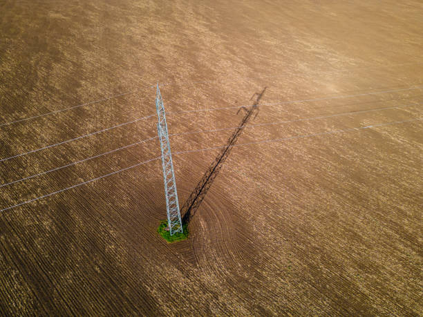 istock Electricity Pole in Cultivated Land in Spring, Aerial view. 2154372965