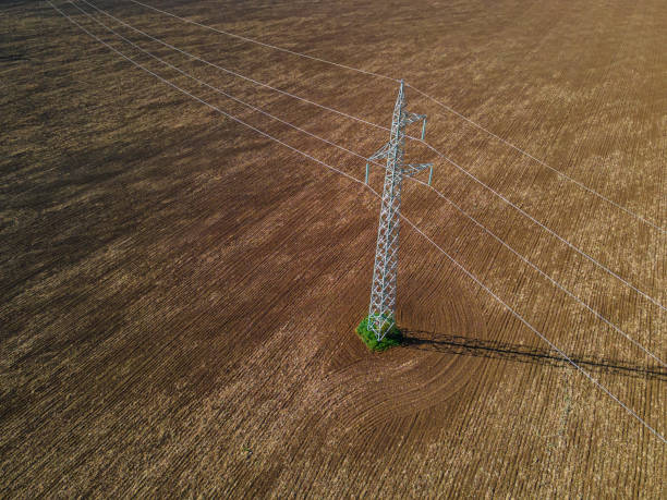 istock Electricity Pole in Cultivated Land in Spring, Aerial view. 2154372970
