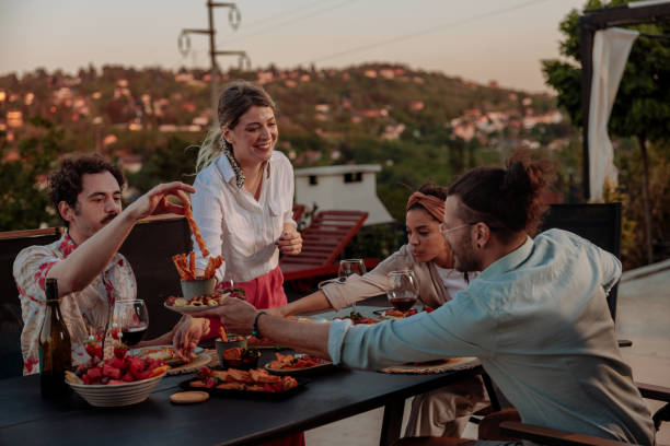 istock Dinner party outdoors for four hungry friends 2154373808