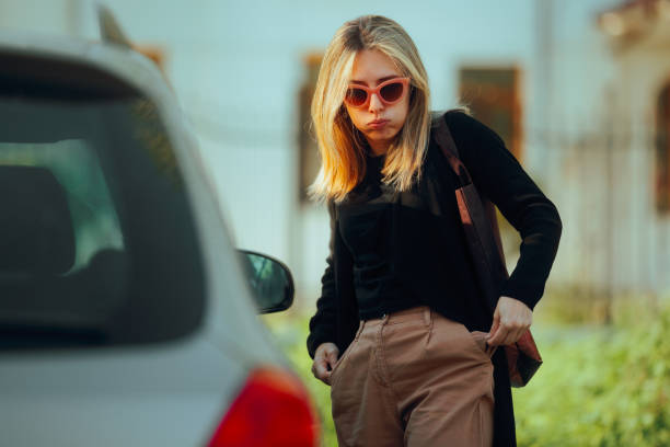 istock Woman Forgetting her Keys Waiting Next to a her Car 2154376012