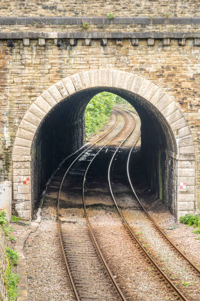 istock Stone Bridge Tunnel with Curving Train Rails Conwy Wales 2154376352
