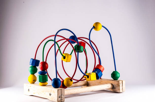 A wooden toy with colorful balls on it