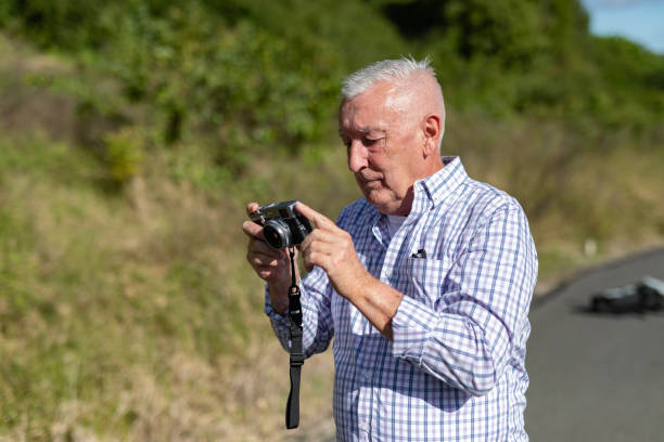 istock Senior Man Taking Photos in a Public Park 2154386960