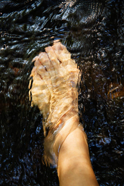 istock Feet in Running Water 2154387477
