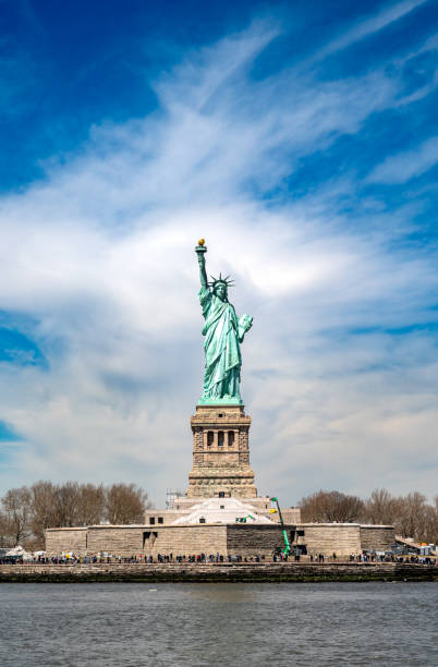 istock Statue of Liberty seen from the river in a clear blue sky 2154391397