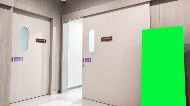 istock Blank roll up stand banner. Blank mockup for presentation isolated on wall background in hospital 2154392686