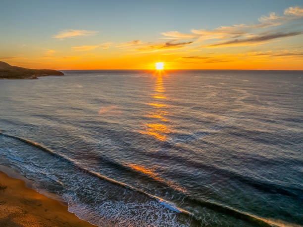istock Sunrise at the seaside with high cloud 2154393702