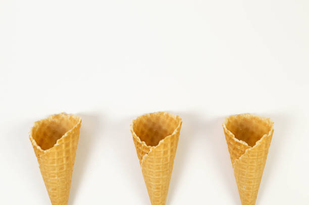 istock Top view of three ice cream waffle cones on white background. 2154402535