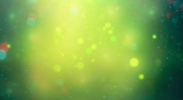 green background with defocused gold, red and blue lights. festive background