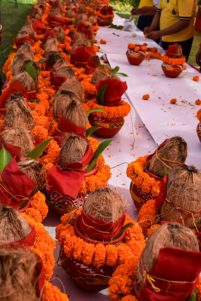 istock Kalash with coconut and mango leaf with floral decoration earthen pots containing sacred water. Kalash for hindu puja during Jagannath Temple Mangal Kalash Yatra, front view, closeup 2154405621