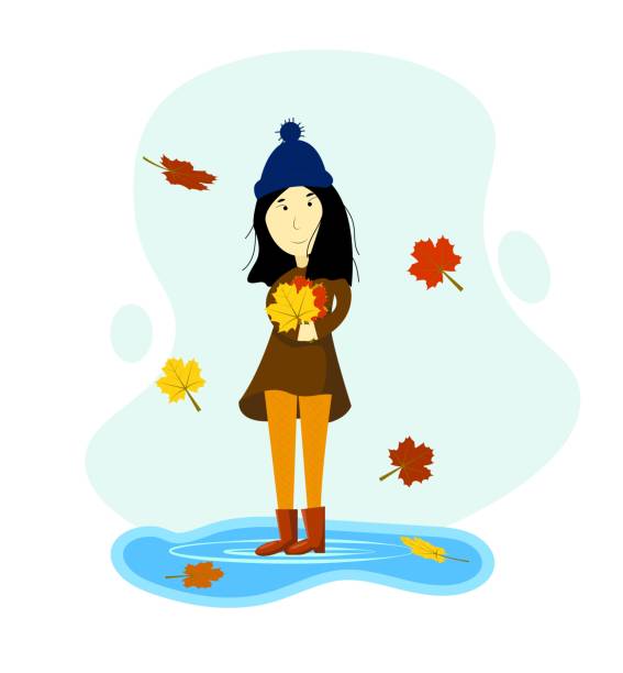 istock Girl in Autumn with Colorful Fallen Leaves in Hands 2154406236