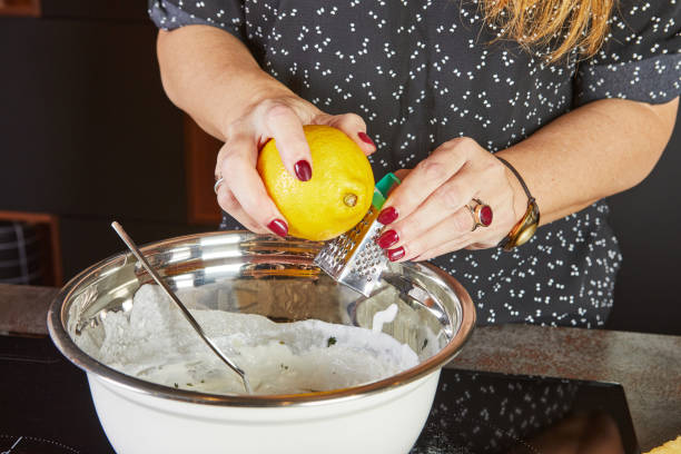 istock Making a pie in your home kitchen from several types of cheeses, grate the lemon zest 2154406283