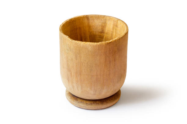 Antique wooden bowl on a white background. With a shadow.