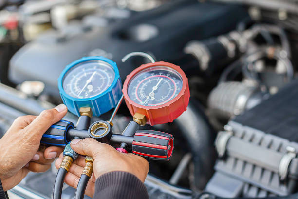 istock Car air conditioner check service, leak detection, fill refrigerant.Device and meter liquid cooling in the car by specialist technicians. 2154407366