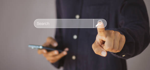 istock Searching the internet with a search bar working on a smartphone, internet network concept. 2154407591