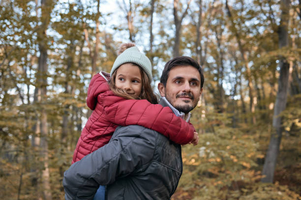 istock Happy father and daughter on an autumn day 2154408354