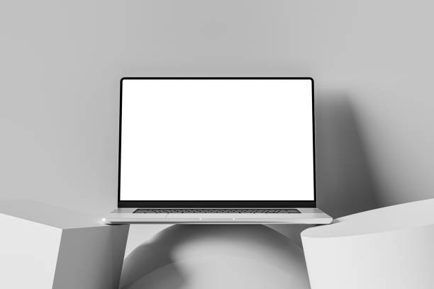 istock Front view of an open laptop with a blank screen, placed on an abstract shapes. Minimalistic and clean workspace with a neutral background, perfect for adding custom content on the laptop screen. 2154409051