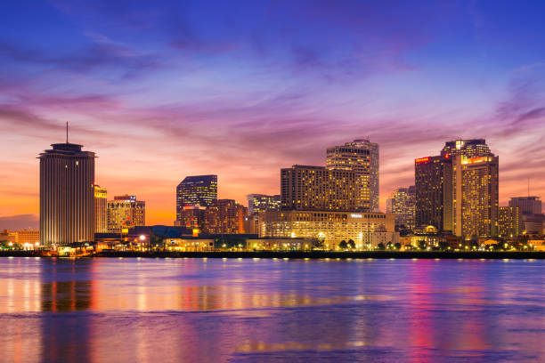 New Orleans Waterfront Skyline At Dusk With Orange Blue Sky