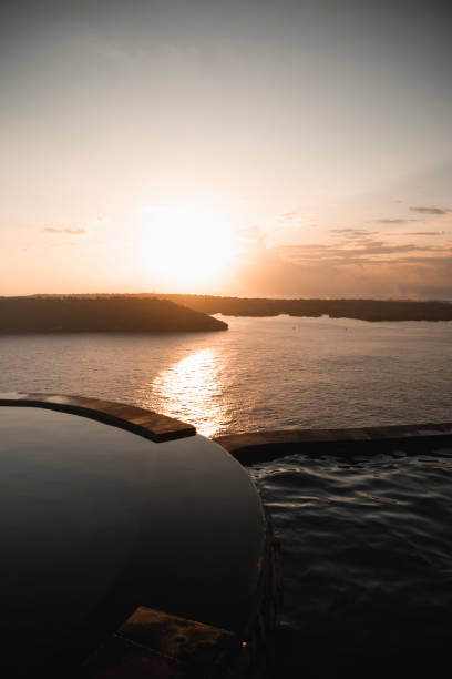 istock Sunset with warm light from an infinity pool in Nusa Penida 2154411842