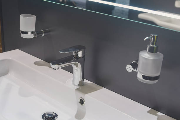 istock White modern rectangular ceramic sink, chrome faucet, dispenser and toothbrush holder 2154411987