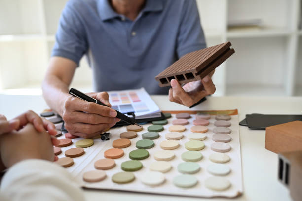 istock Closeup professional interior designer helping client choosing colors in swatches palette for apartment renovation 2154412331